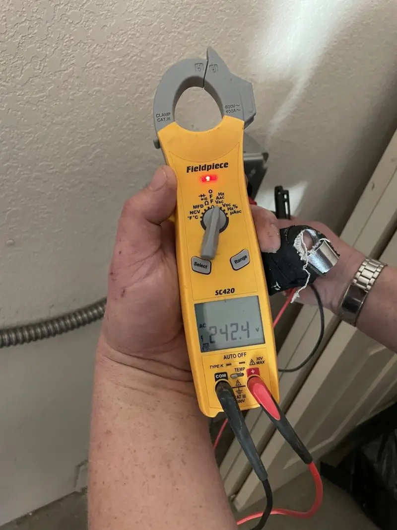 Voltage testing with clamp meter during Ceiling Fan Installation in Gary